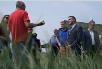 Shawn Janse, manager of the Ontario Crops Research Centre – Bradford, explains integrated pest management programs and research trials to Todd McCarthy, Ontario minister of the environment, conservation and parks and Trevor Jones, Ontario minister of agriculture, food and agribusiness. To the far left is Caroline Mulroney, MPP, York-Simcoe and to the far right is Rene Van Acker, president of the University of Guelph. Photo by Matthew Higginson.