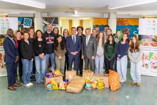 Trevor Jones, Ontario minister of agriculture, food and agribusiness (centre) stands beside Paul Calandra, Ontario minister of education at Malvern Collegiate Institute in Toronto. 
