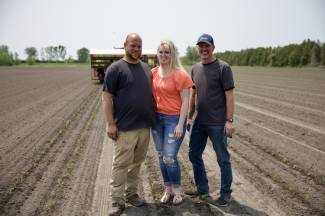 L-R: Adrien, Nicole, and Luc Pinsonneault give Canadians a behind-the-scenes look at how tomatoes are grown and harvested on their farm for processing.