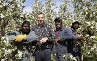 L-R: Orane Walters, Robert Shuh, Dave Brown and Maxroy Messam at Shuh Orchards near Elmira, Ontario.