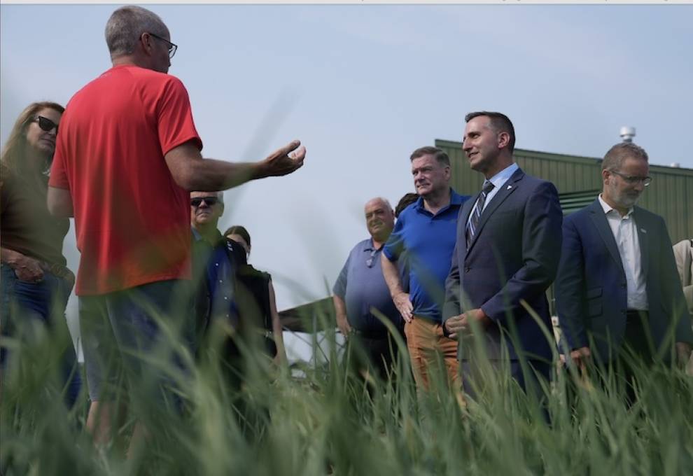 Shawn Janse, manager of the Ontario Crops Research Centre – Bradford, explains integrated pest management programs and research trials to Todd McCarthy, Ontario minister of the environment, conservation and parks and Trevor Jones, Ontario minister of agriculture, food and agribusiness. To the far left is Caroline Mulroney, MPP, York-Simcoe and to the far right is Rene Van Acker, president of the University of Guelph. Photo by Matthew Higginson.
