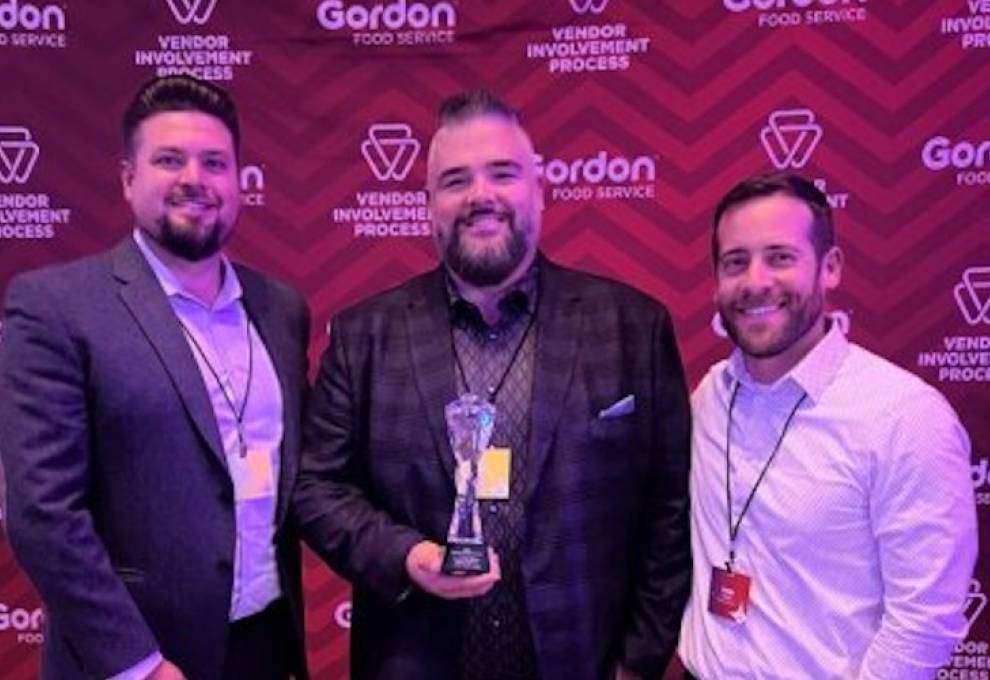 L-R: Derek Kostynuik (director of sales, Peak of the Market), Jason Miklovich (account manager, Peak of the Market) and Mark Donker (North American associate category manager, Gordon Food Service) with the Regional Supplier Partner Award.