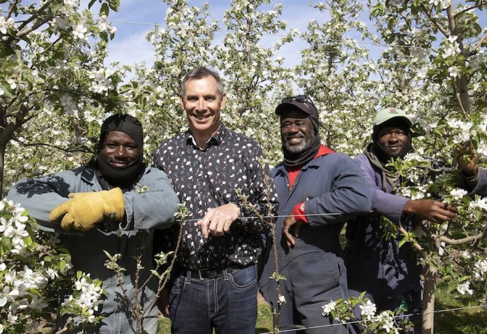 L-R: Orane Walters, Robert Shuh, Dave Brown and Maxroy Messam at Shuh Orchards near Elmira, Ontario.