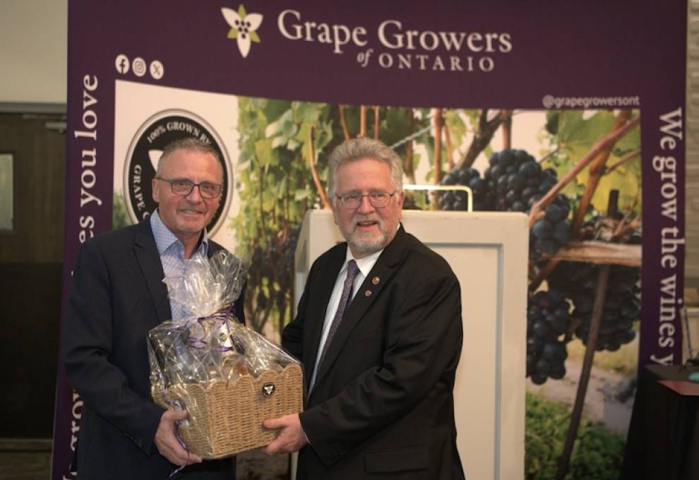 Matthias Oppenlaender (L) receives a token of appreciation for his leadership from Senator Robert Black