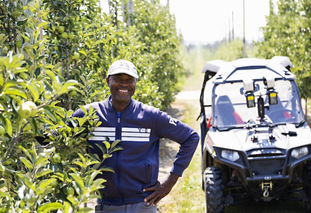 One of the participants of the Seasonal Agricultural worker Program is Q Simpson from Clarendon Parish, Jamaica. Since coming to Canada since 2007, he’s built a new house. During the growing season, he is based at Top Meadow Orchards in Clarksburg, Ontario. Photo by Nancy French. 