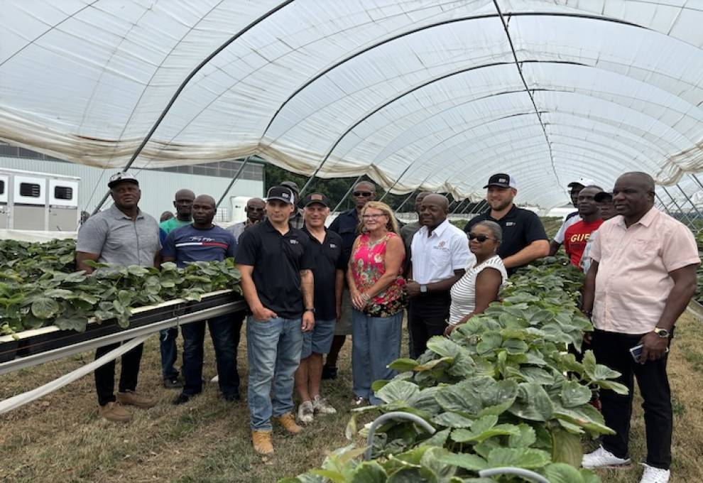 Hon. Pearnel Charles Jr. is pictured in the middle surrounded by John and Diane Cooper, their sons Dalton and Mason, Althea Riley, Jamaican Liaison Office and several Jamaican workers. 