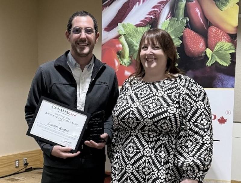 Cameron Korpan receives the Sheri Nielson Auditor Recognition Award from the 2024 winner, Danni Kneeland.