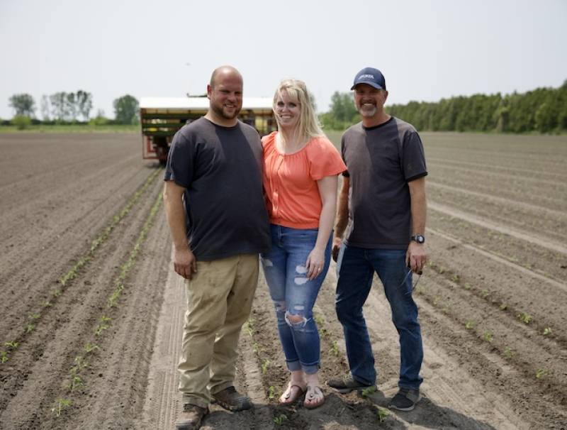 L-R: Adrien, Nicole, and Luc Pinsonneault give Canadians a behind-the-scenes look at how tomatoes are grown and harvested on their farm for processing.