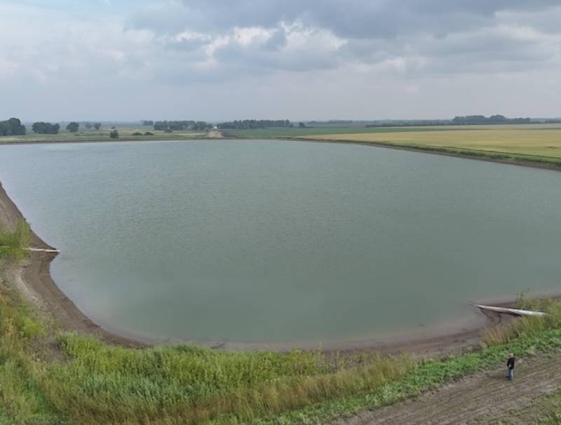 Southern Potato Company Inc. is managing drought risk with a massive water storage and irrigation system for 2,500 acres of fresh, chip and seed potatoes. The Kuhl family is committed to that conservation effort near Winkler, Manitoba. Marlon Kuhl can be spotted in the bottom right-hand corner of the photo taken by Steve Langston. 