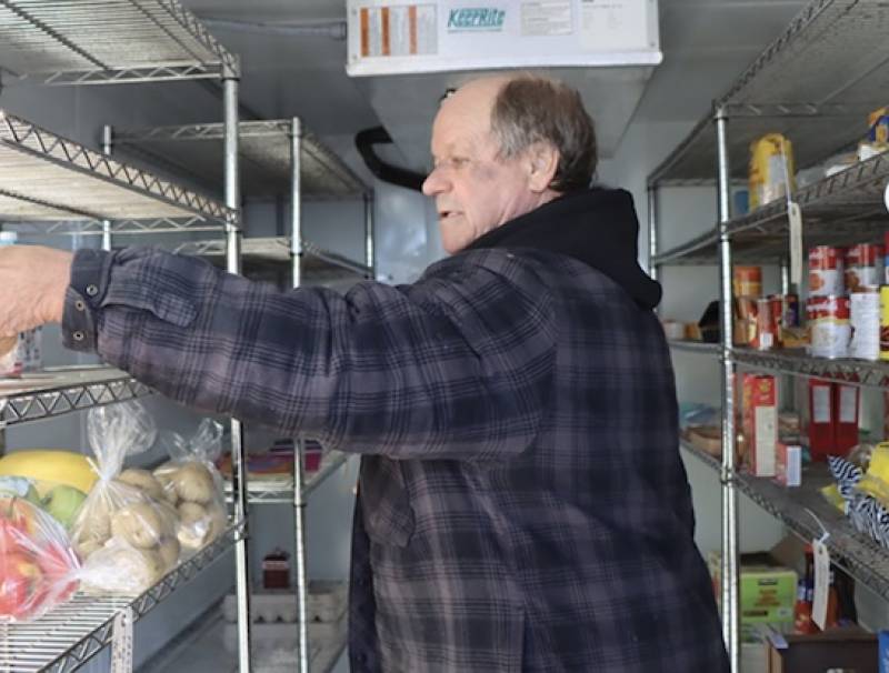 Larry Leckie, volunteer, at Petrolia Community Refrigerator. 